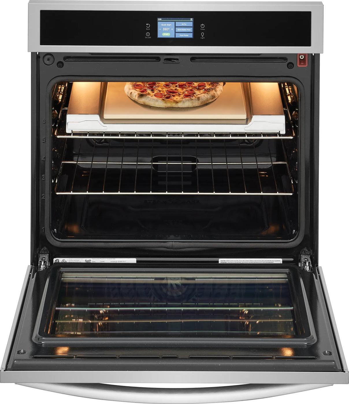 Stainless steel single electric wall oven with digital display and stone-baked pizza inside from Wall Ovens collection