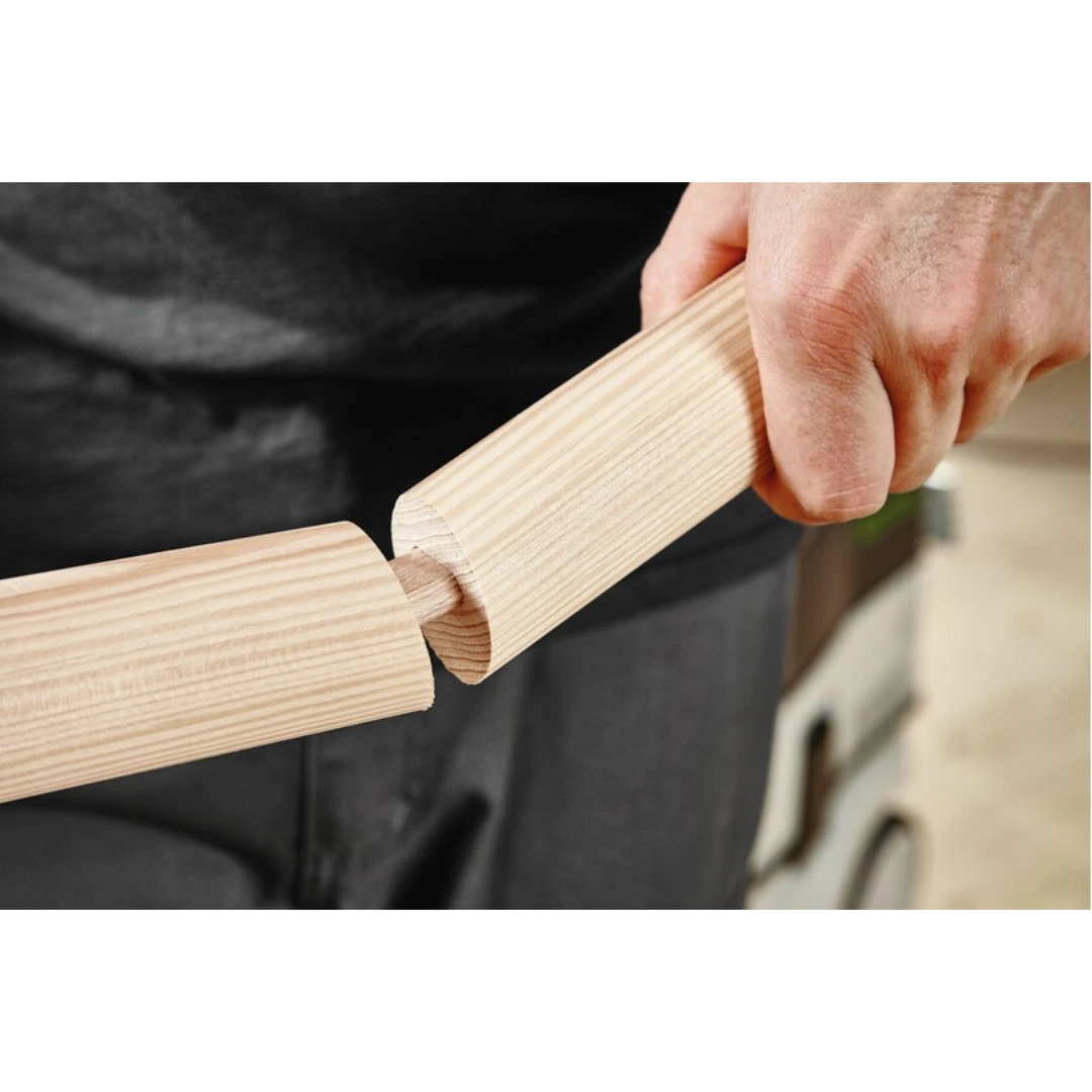 Hand inserting a beech domino tenon into wood joint for woodworking using Festool tool accessories.