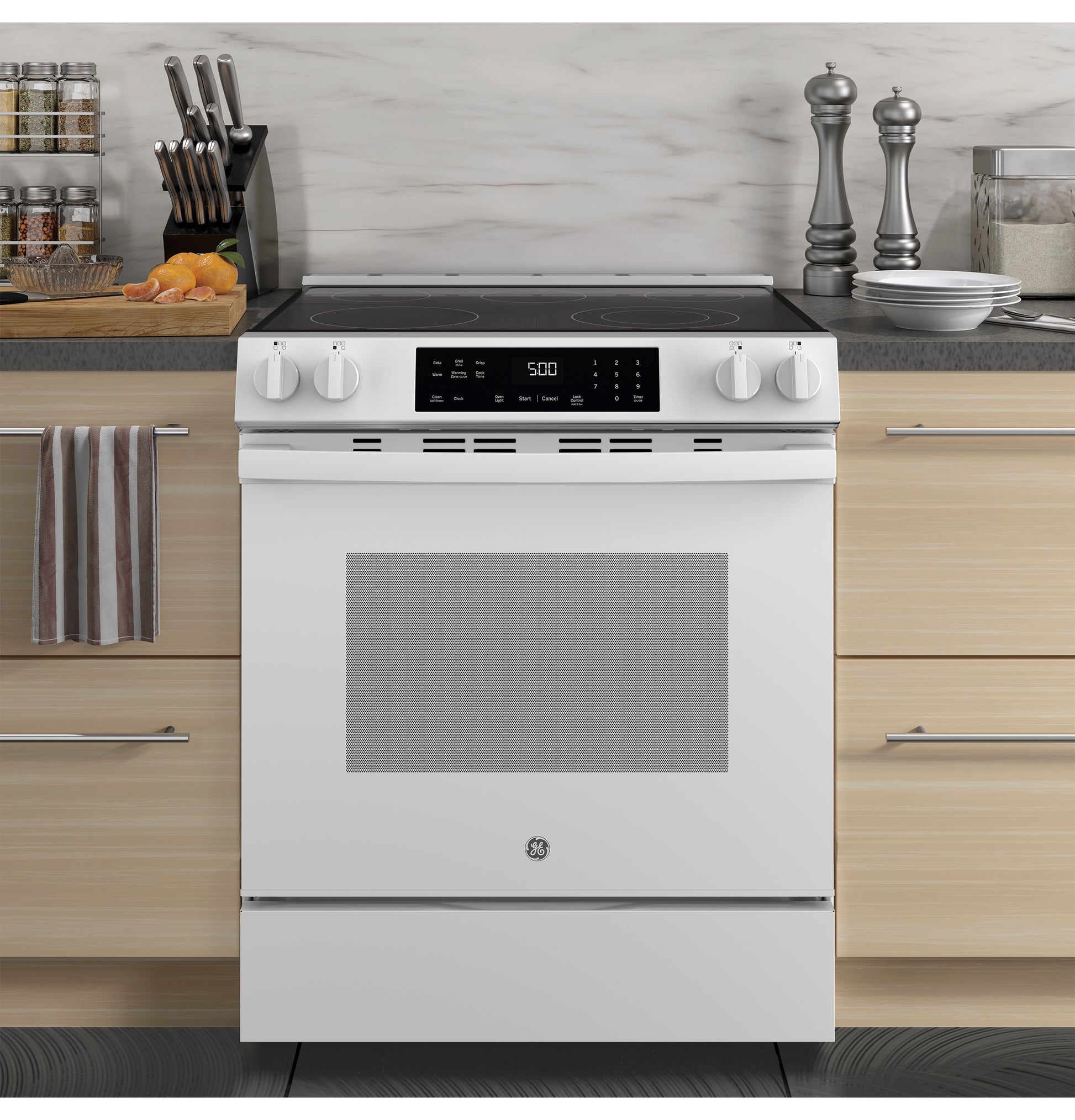 White slide-in electric range with digital touch controls and four knobs in modern kitchen for home improvement tools