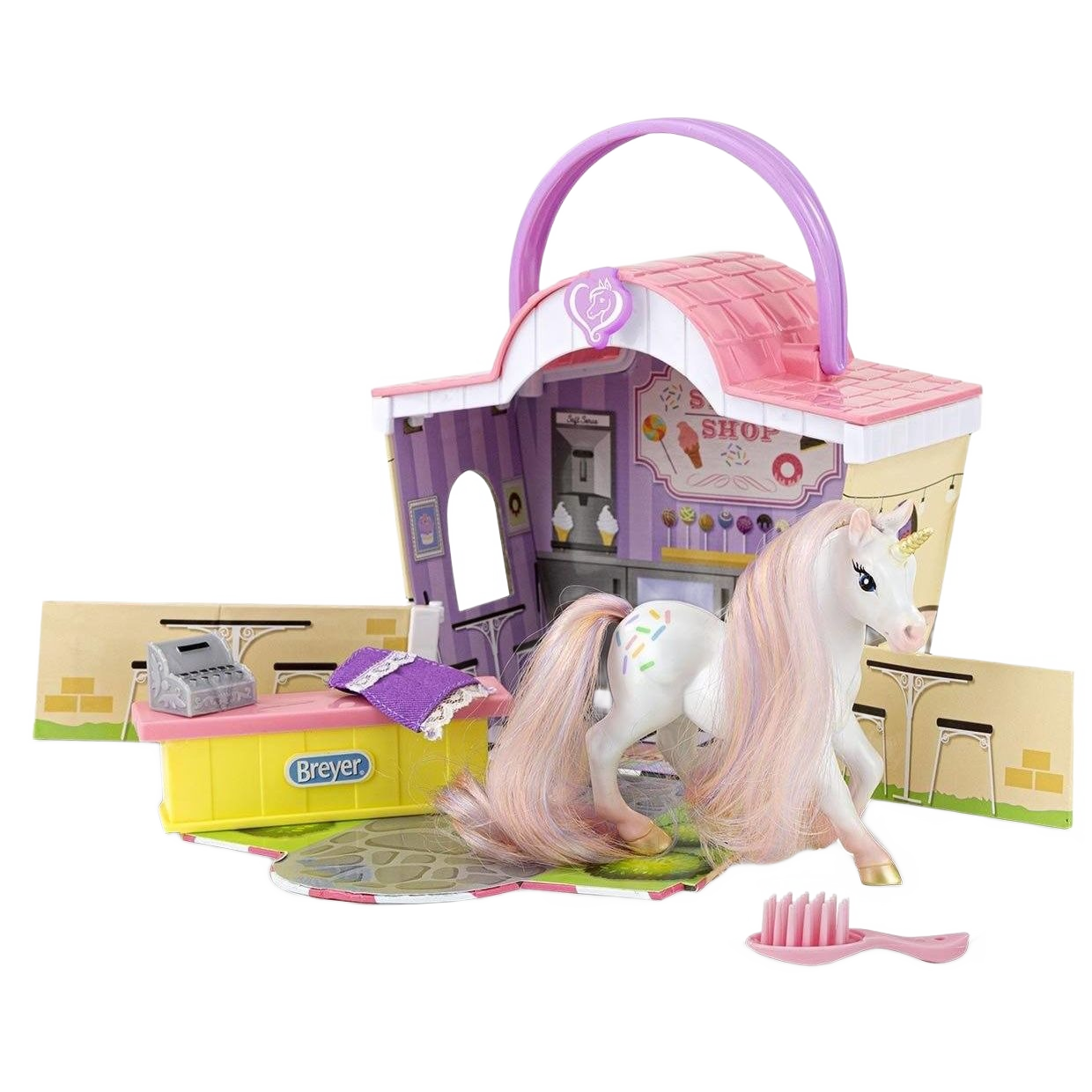 Toy sweet shop playset with a white unicorn figure featuring a pastel mane and sprinkle decorations