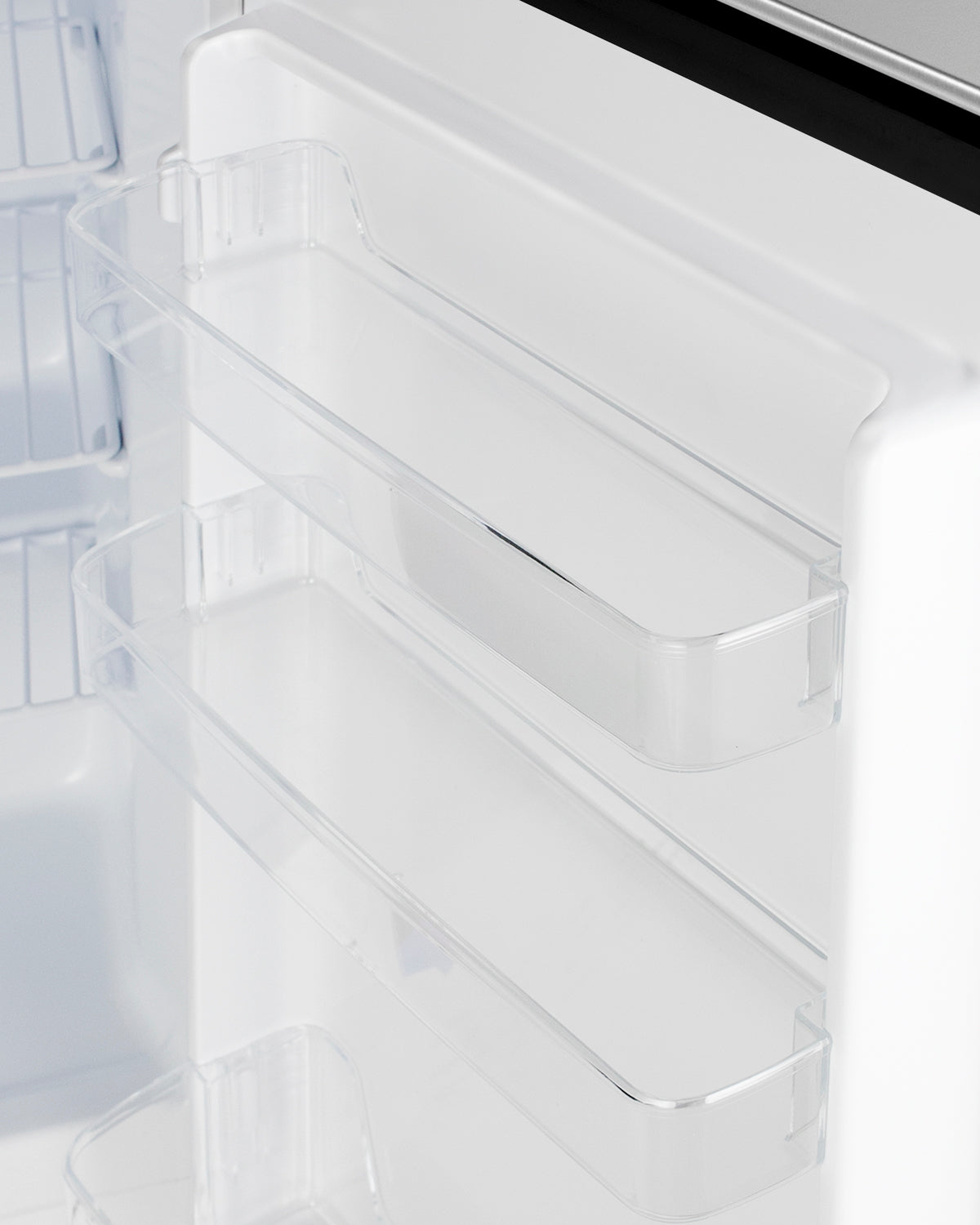 Clear plastic door bins inside white built-in freezer unit from freezers and kitchen appliances collection