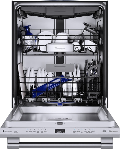 Open professional stainless steel dishwasher loaded with plates, bowls, and kitchen utensils from Thermador collection