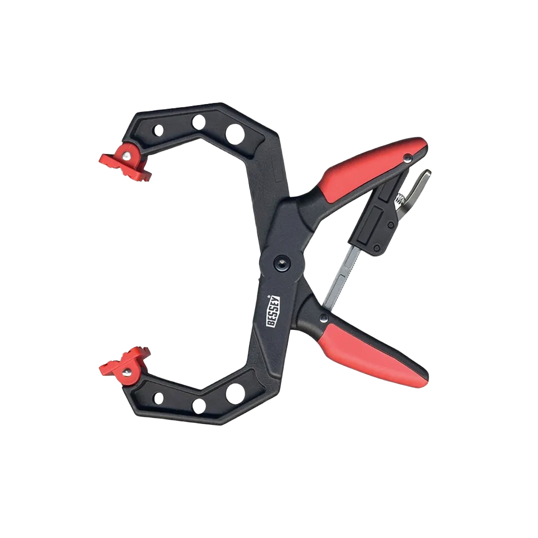 Ratchet spring clamp with red handles and wide grip for precise holding in home improvement and woodworking tasks