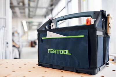 Navy blue and black portable tool bag with multiple pockets for organized workshop and jobsite tool storage