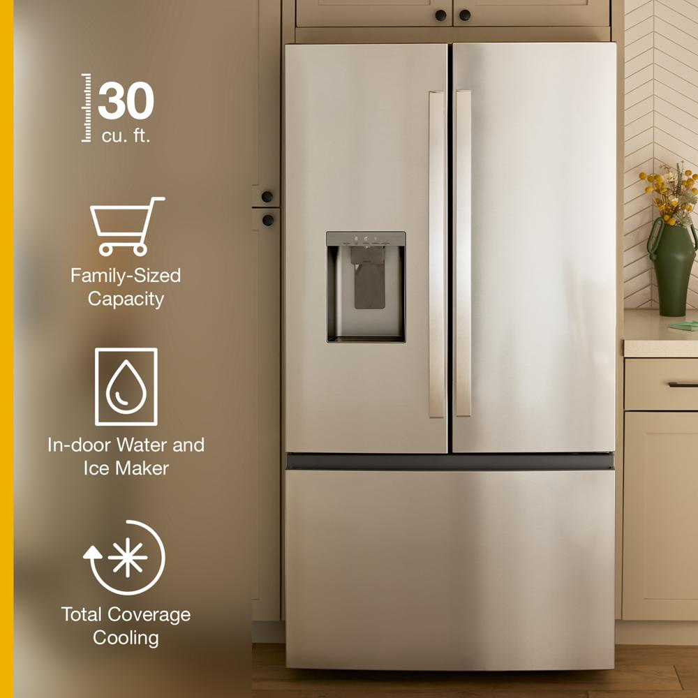 Stainless steel French door refrigerator with bottom freezer, in-door water and ice dispenser, and modern kitchen setting.