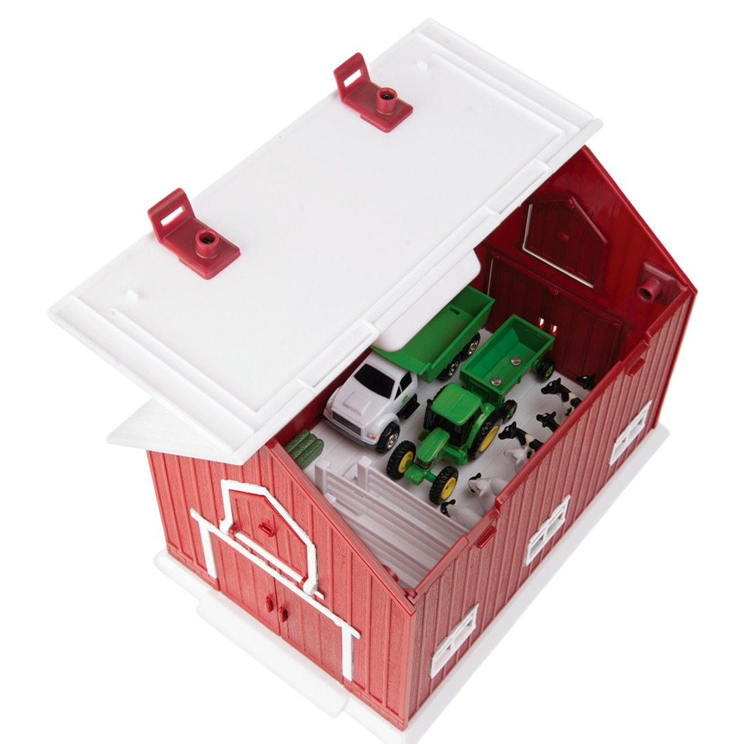 Red plastic barn toy with hinged white roof and miniature farm vehicles and animals inside in 1/64 scale set