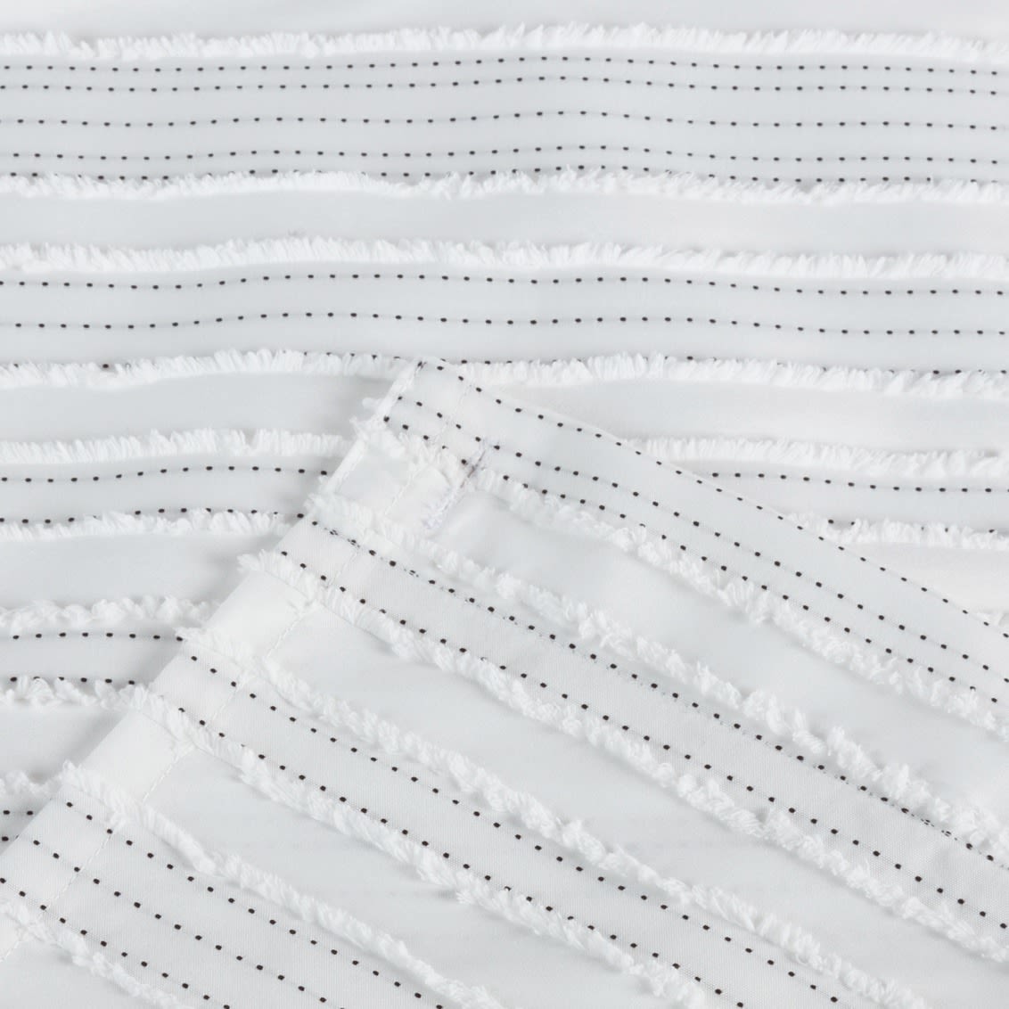 White polyester shower curtain with textured horizontal stripes and delicate dotted backstitch detailing for bathroom accessory collections