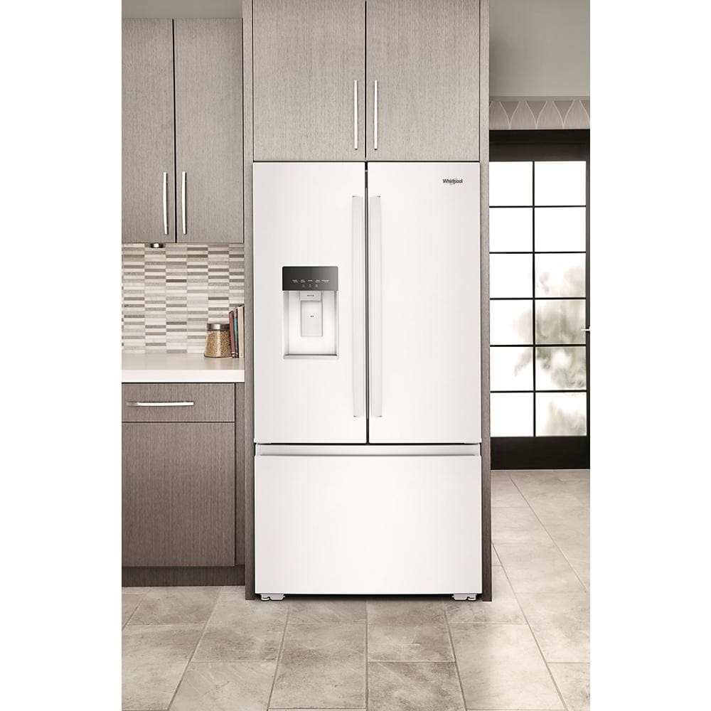 White French door refrigerator with bottom freezer and in-door water dispenser in modern kitchen setting