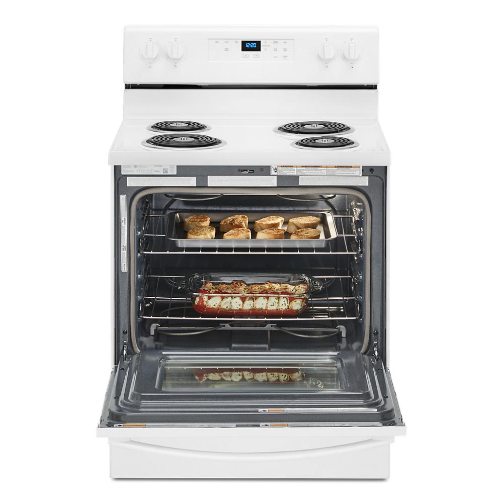 White electric range with four coil burners and oven door open showing baking trays with food inside from Ranges collection
