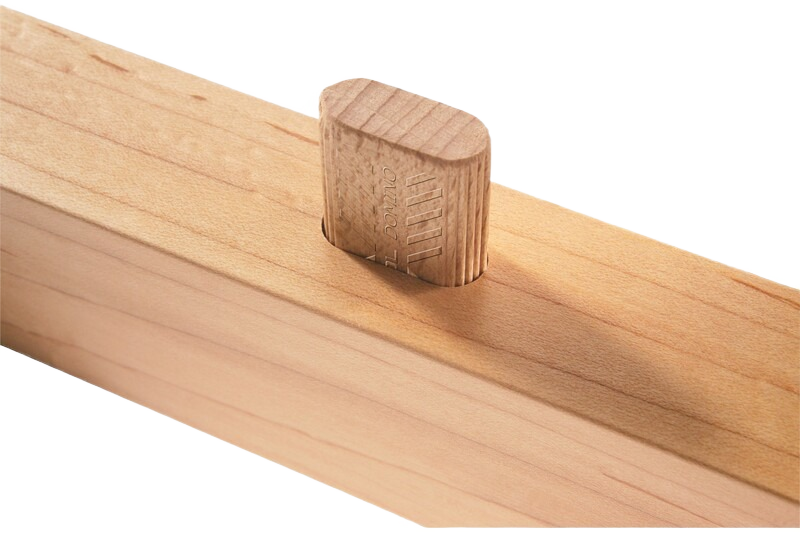 Close-up of beech wood domino tenon inserted in a wood joint for woodworking tool accessories and home improvement