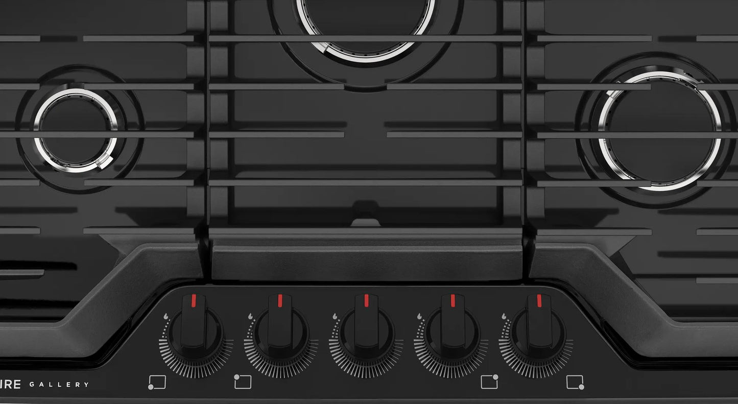 Black cooktop with five burners and continuous cast iron grates for versatile cooking in modern kitchens
