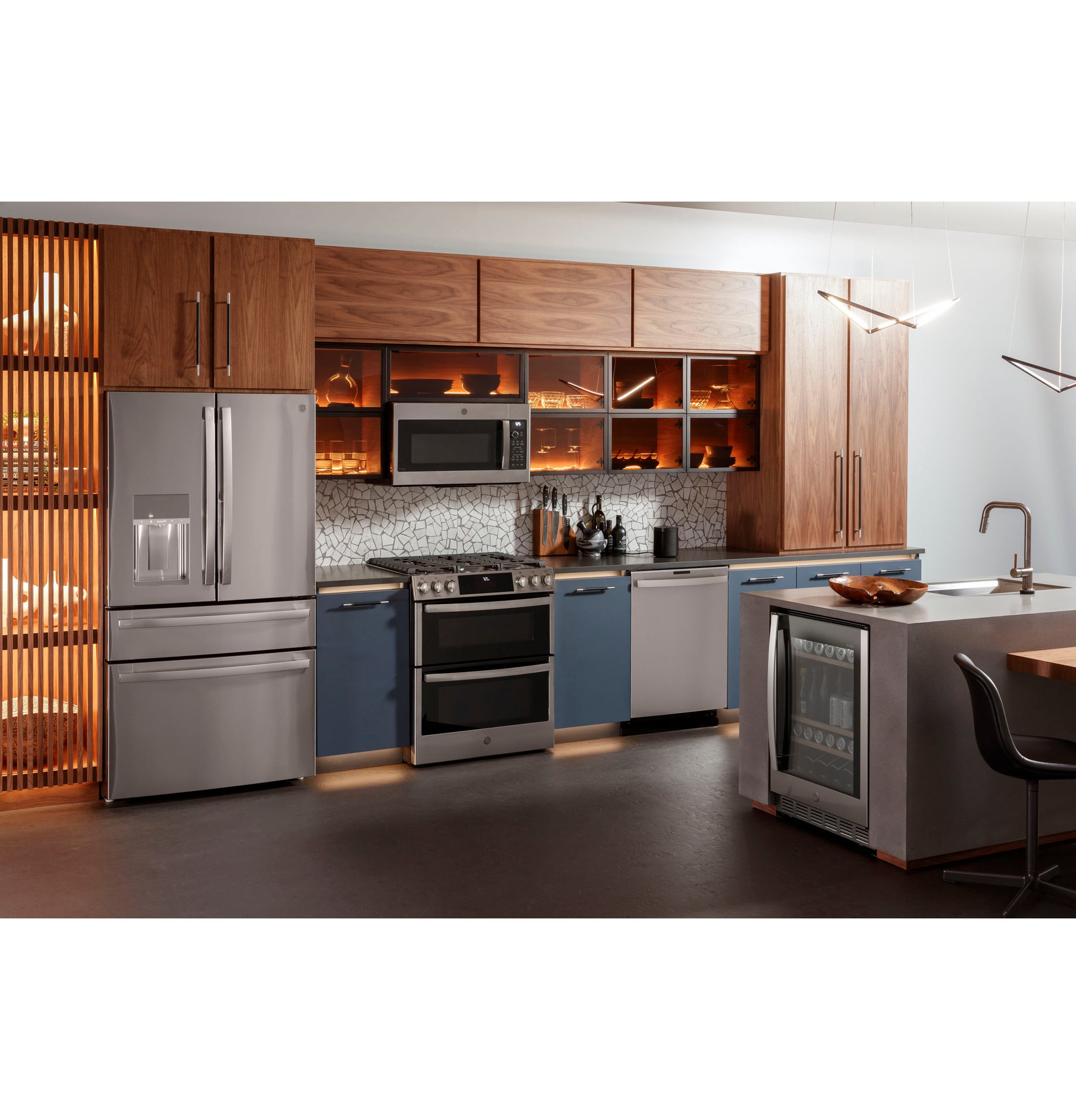 Contemporary kitchen with stainless steel French door refrigerator, gas double oven range, and built-in microwave from Ranges collection