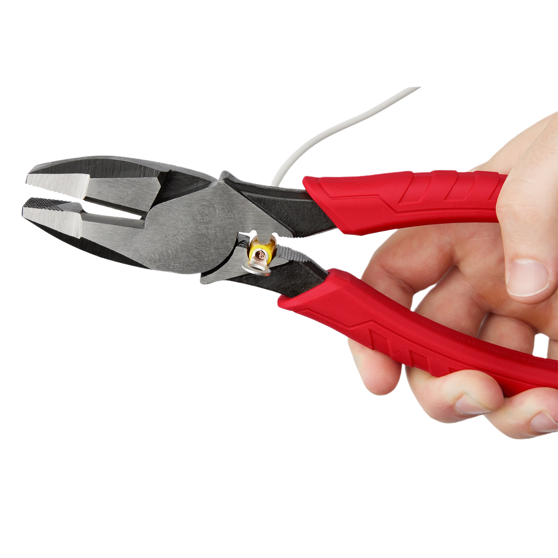 High leverage lineman’s pliers with red comfort grip handles held for cutting and crimping in hand tools and woodworking sets