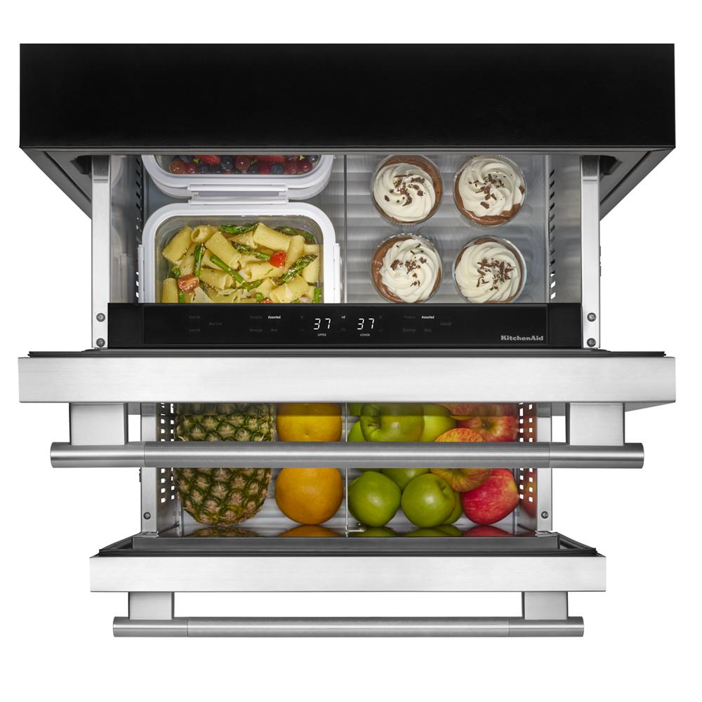 stainless steel double-drawer refrigerator with LED lighting and visible storage of fruits and desserts for kitchen appliances