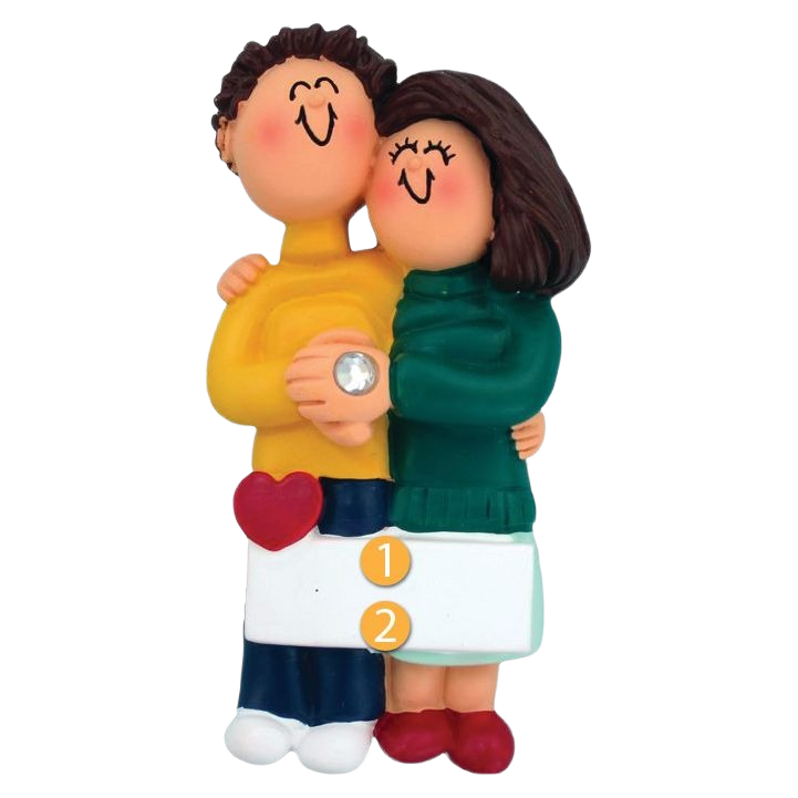 Personalized figurine ornament of a brunette engaged couple hugging with heart detail from Christmas Ornaments collection