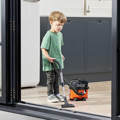 Child using Casdon Henry and Hetty miniature vacuum cleaner toy for pretend play in Toys & Games under $50 collection