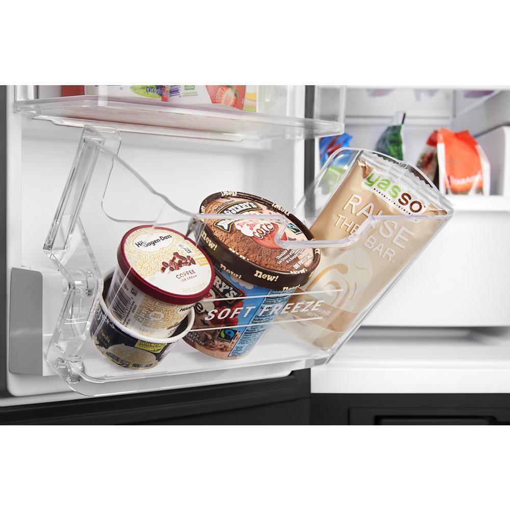 Soft Freeze Bin inside refrigerator door holding ice cream containers and a snack bar for kitchen appliances use