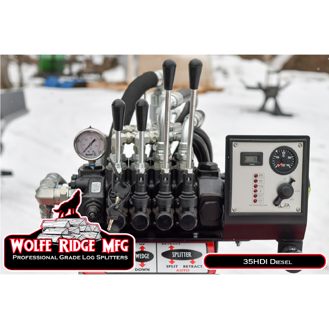 Hydraulic control panel with levers, pressure gauge, and diesel engine display on heavy-duty log splitter outdoors in snow