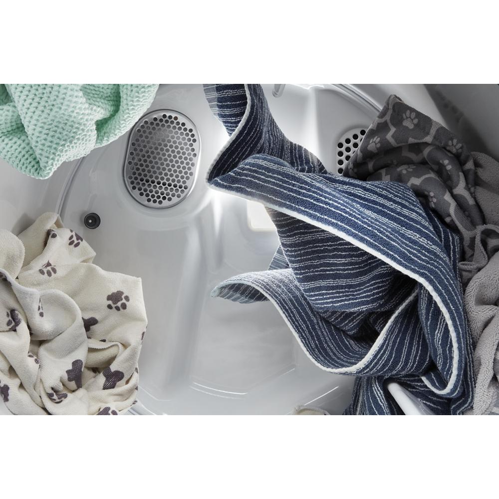 Interior view of Pet Pro top load electric dryer drum with assorted laundry from Dryers and Appliances collections