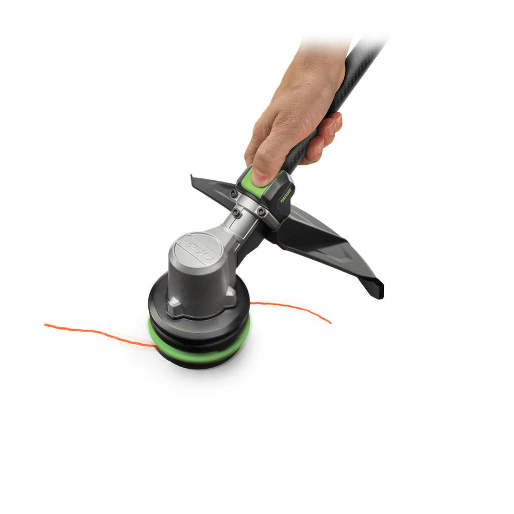 Close-up of hand holding cordless string trimmer with carbon fiber shaft and Powerload™ system for lawn edging tasks