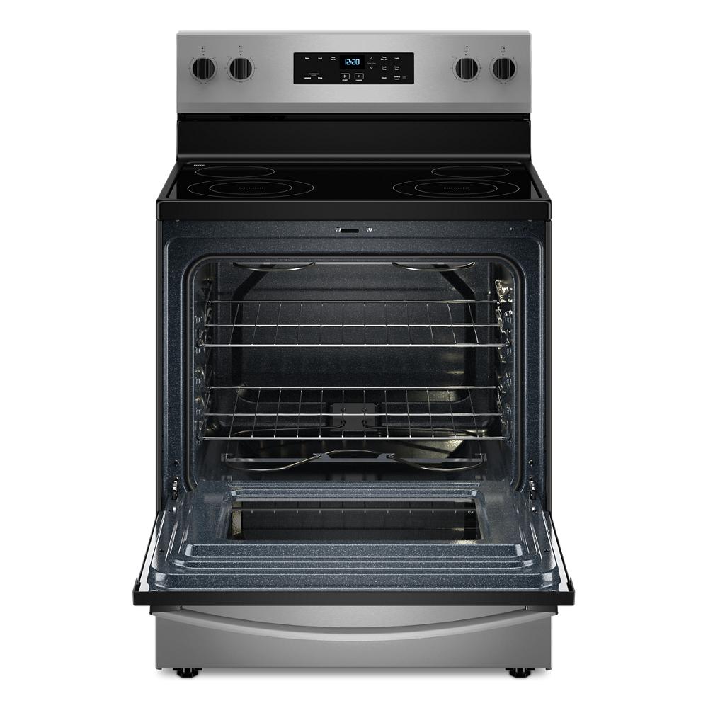 30-inch stainless steel electric range with ceramic cooktop and open oven door in kitchen appliances category