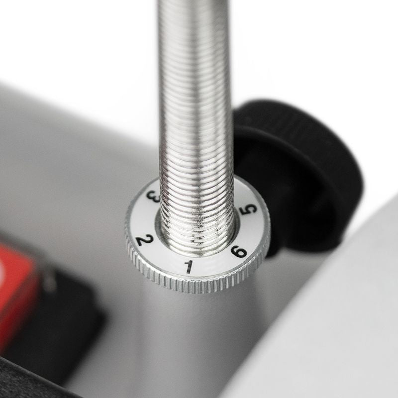 Close-up of micro adjustment dial on metal threaded shaft for precise tool support in home improvement tasks