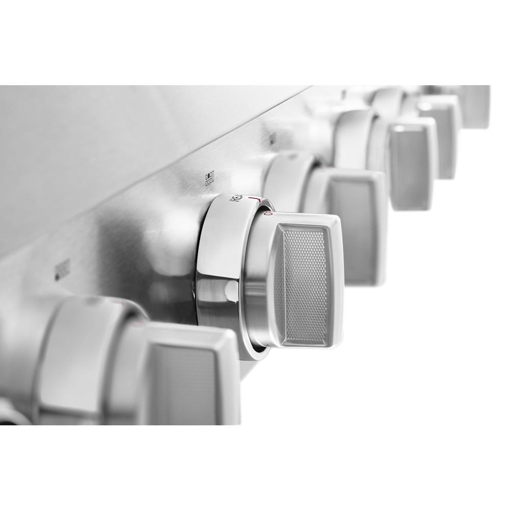 Close-up of stainless steel control knobs on a commercial-style 48-inch gas cooktop from KitchenAid collection