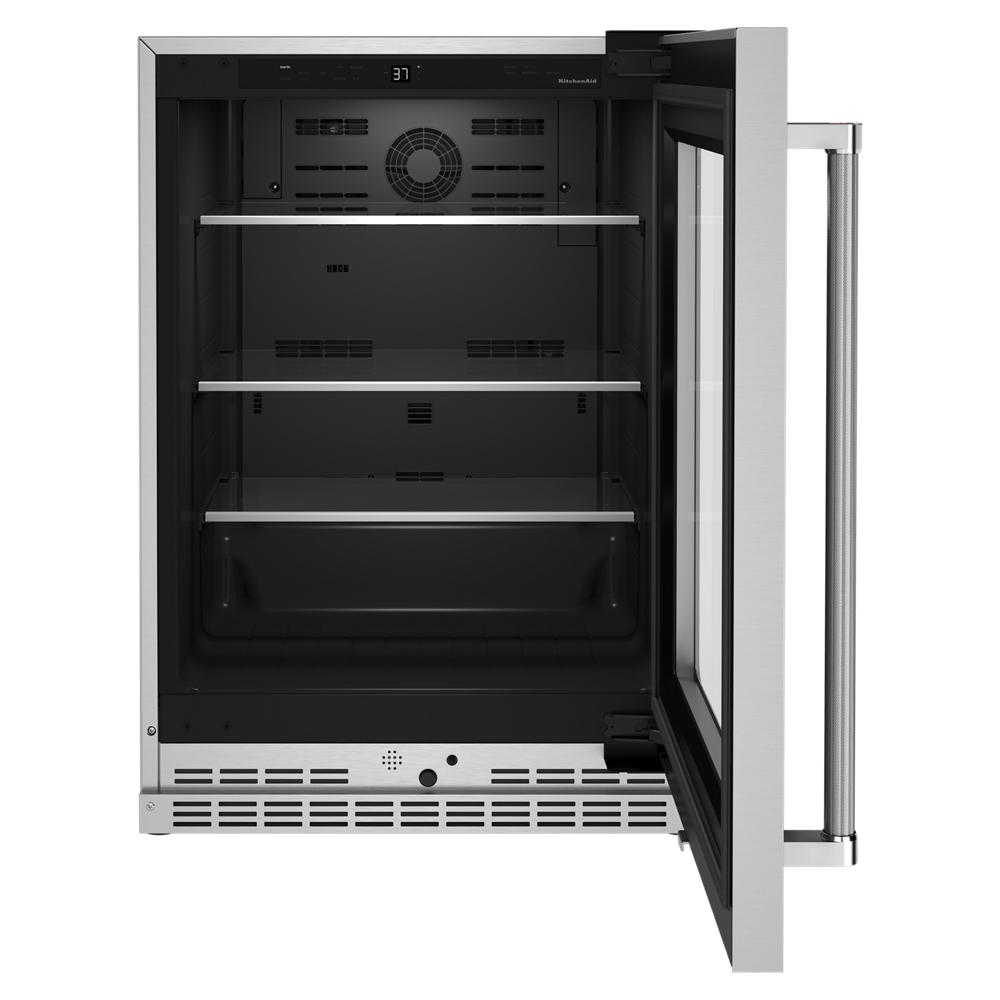 Undercounter refrigerator with open glass door, metal shelves, and stainless steel accents in KitchenAid appliances collection