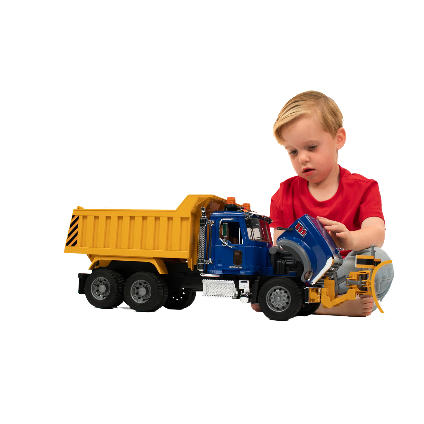 Child playing with detailed blue and yellow Bruder 1:16 scale Mack Granite dump truck toy from Vehicles & Remote Controlled Toys collection