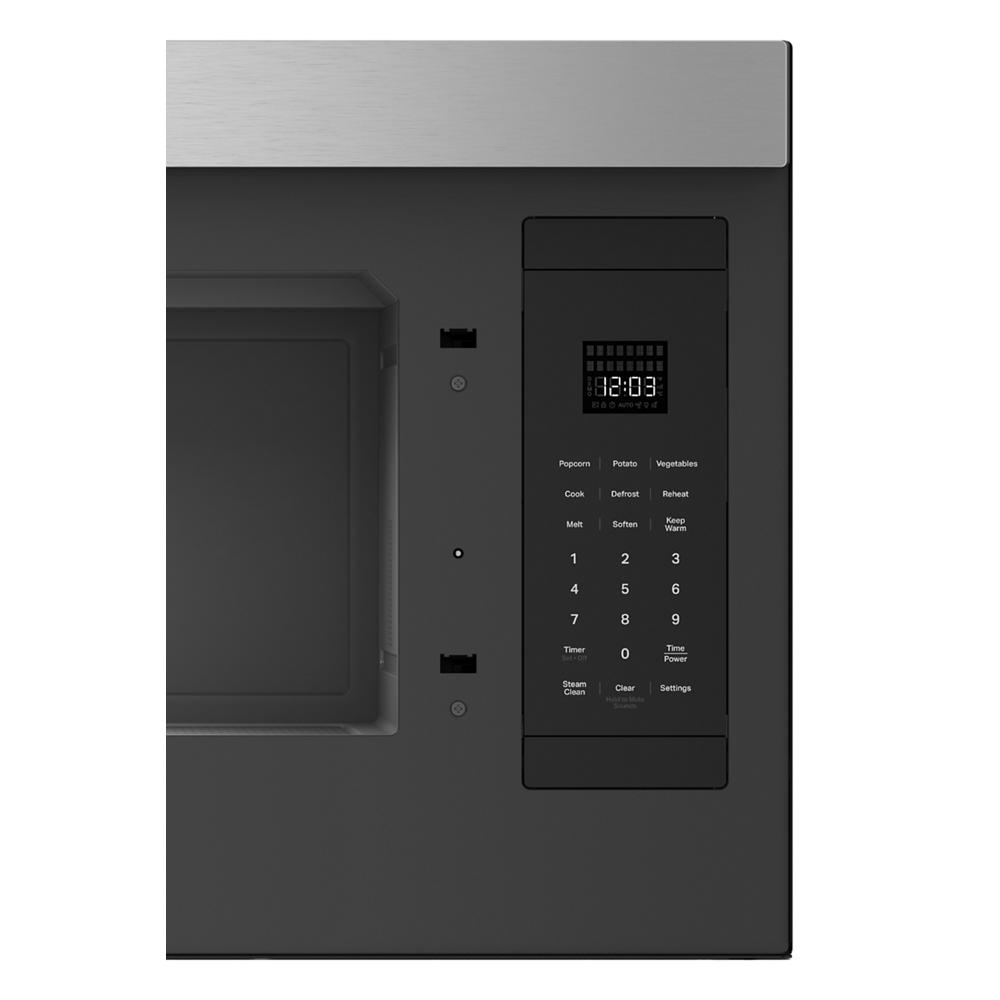 Close-up of black microwave control panel with digital clock and touchpad settings from KitchenAid appliances collection