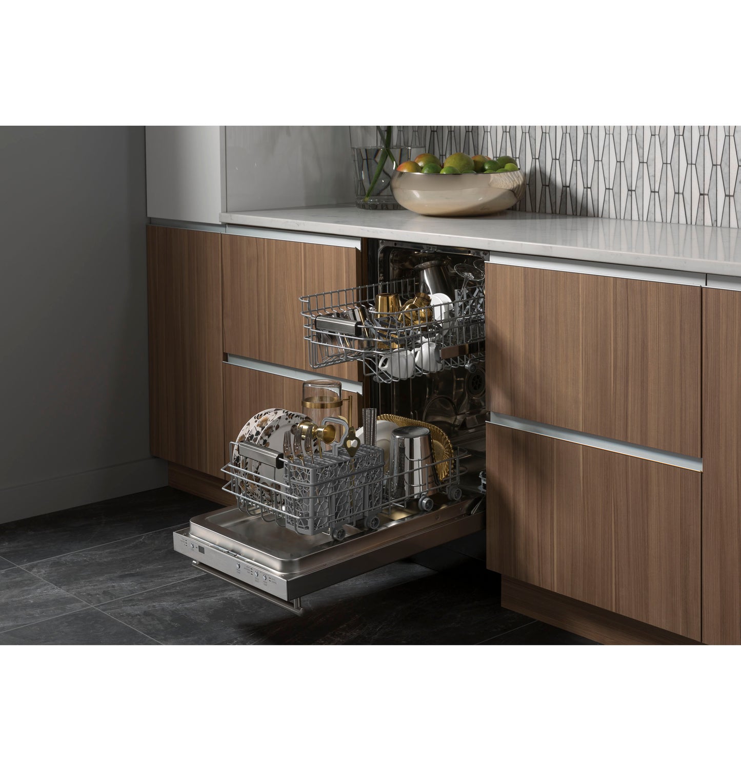 Open panel-ready dishwasher integrated into wood cabinetry with kitchenware inside in modern kitchen setting