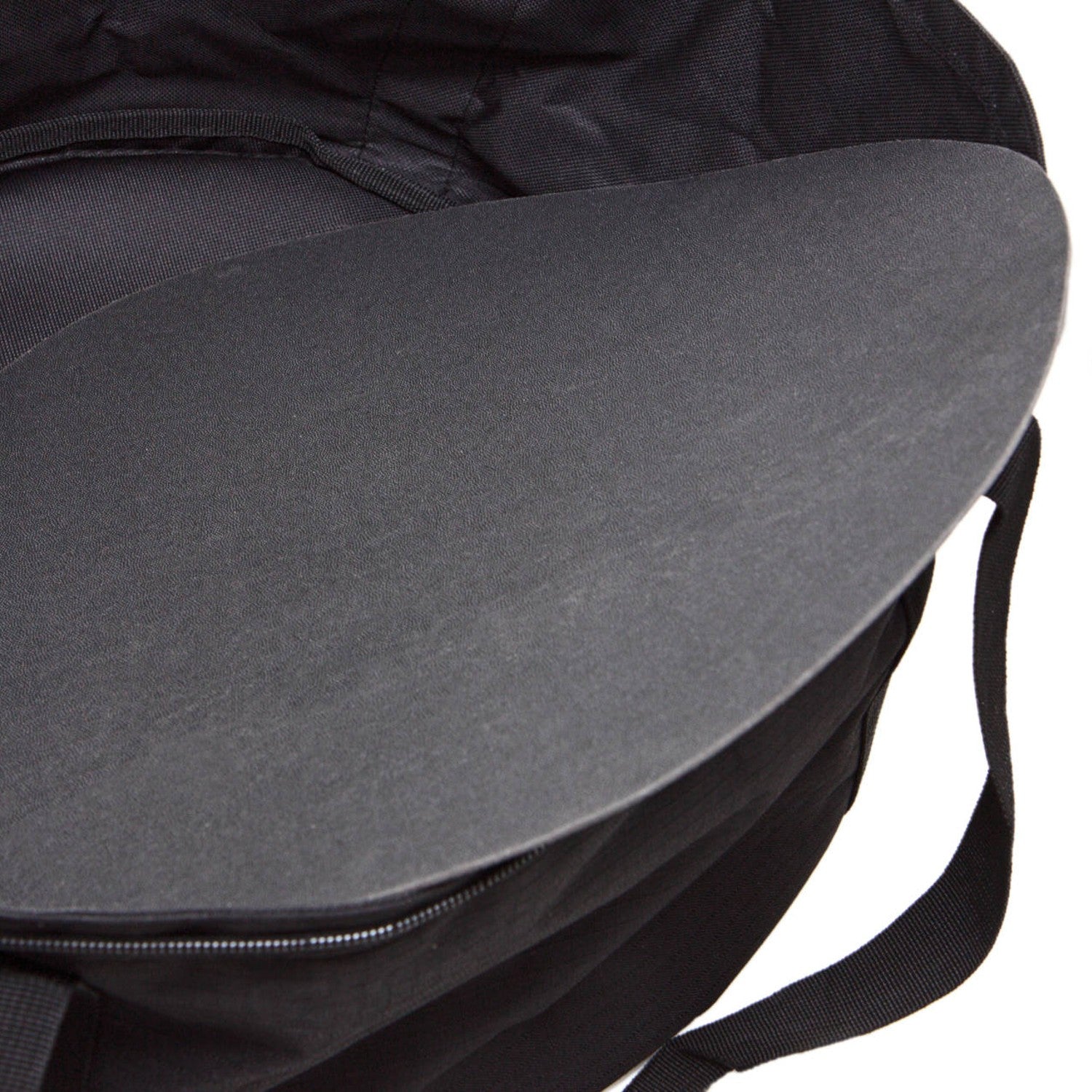 Round flat griddle inside a black nylon transport bag designed for easy camping and outdoor kitchenware storage