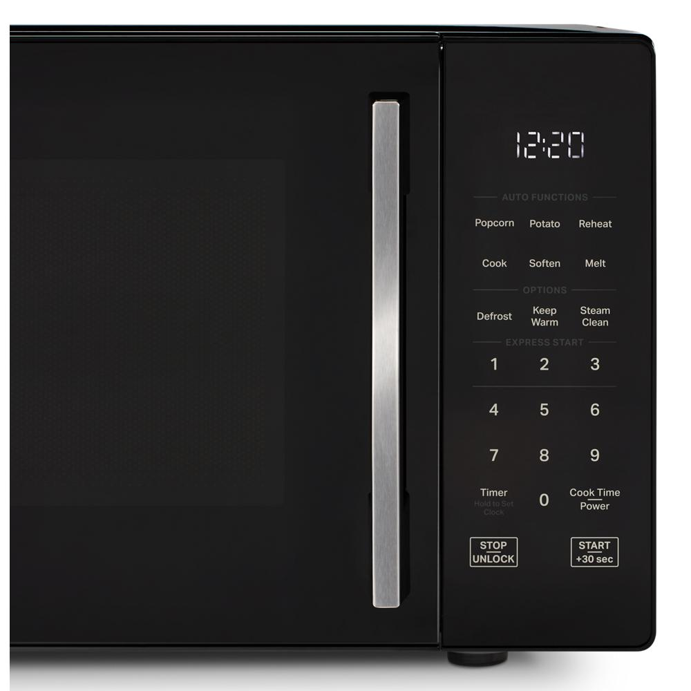 Black countertop microwave with digital display showing clock and touch control panel with steam clean option
