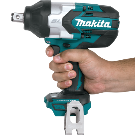 Hand gripping teal and black cordless impact wrench designed for efficient home improvement tasks and tools use