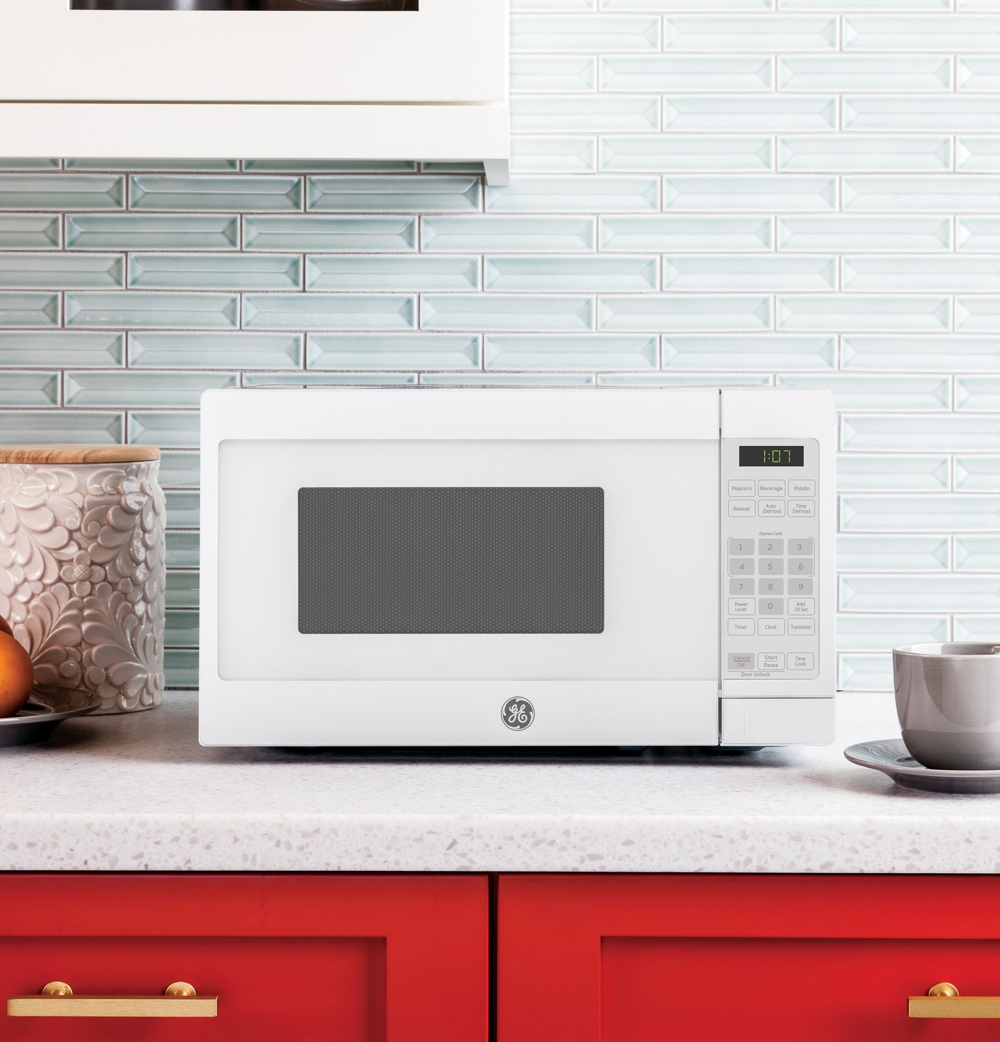 White countertop microwave with digital control panel on kitchen counter in microwaves and appliances collection