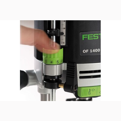 Hand adjusting the depth control on a Festool OF 1400 router for precise home improvement tasks