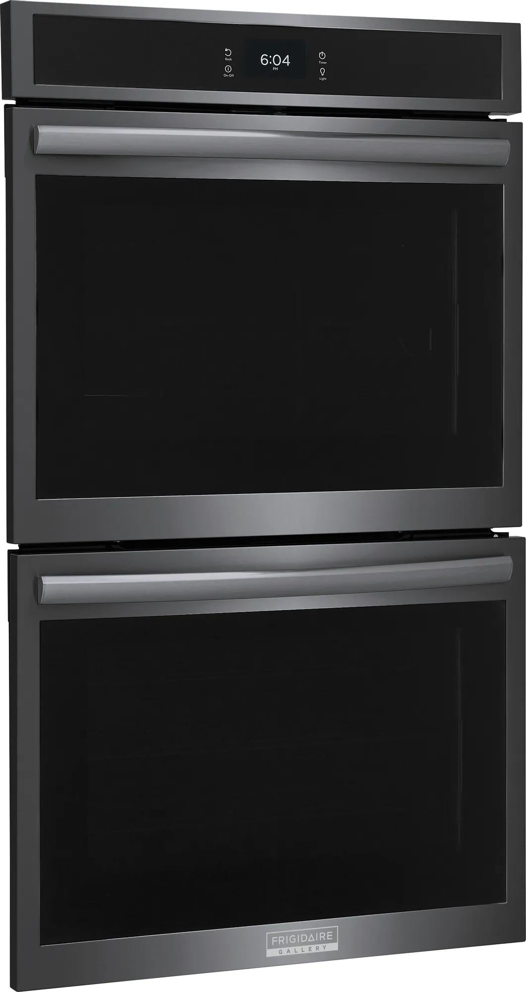Sleek black double electric wall oven with stainless steel handles and digital clock display in modern kitchen setting