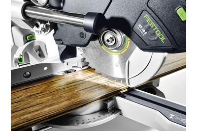 Cordless compound miter saw cutting wood plank with precise angle adjustment for woodworking projects