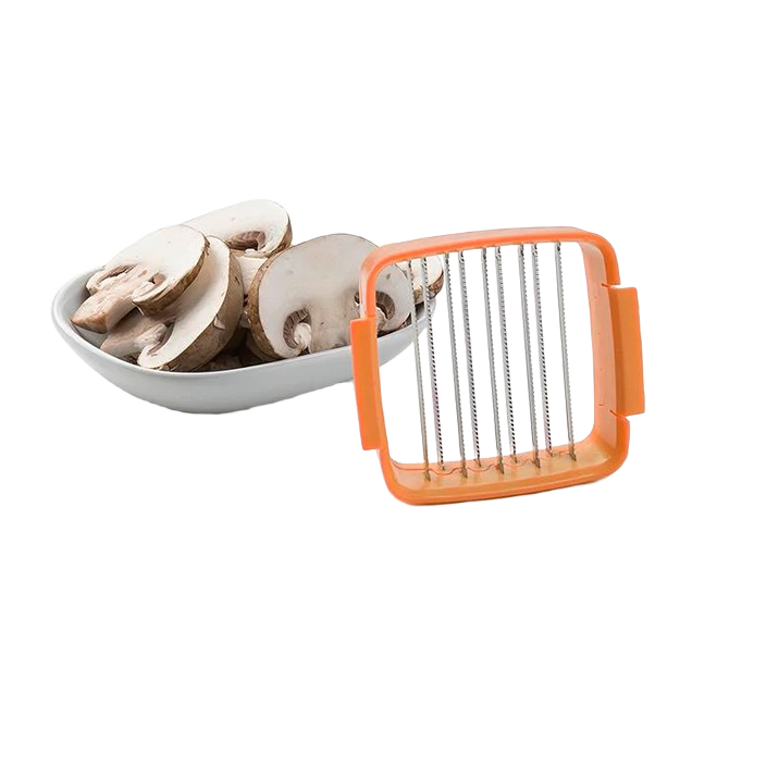 Orange food chopper blade attachment slicing fresh white mushrooms on bowl in kitchenware collection under $50