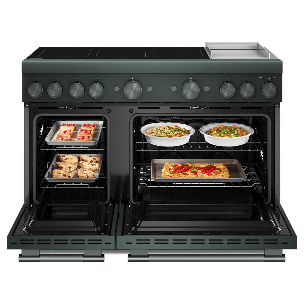 48-inch dark green freestanding induction range with dual ovens open showing baked dishes in KitchenAid collection