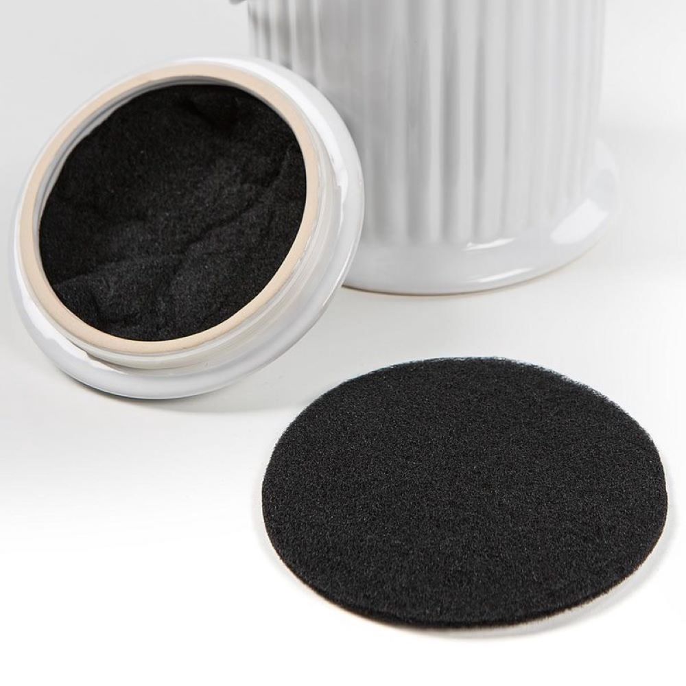 Round black compost filter refill pad shown with white ceramic compost keeper for home improvement use