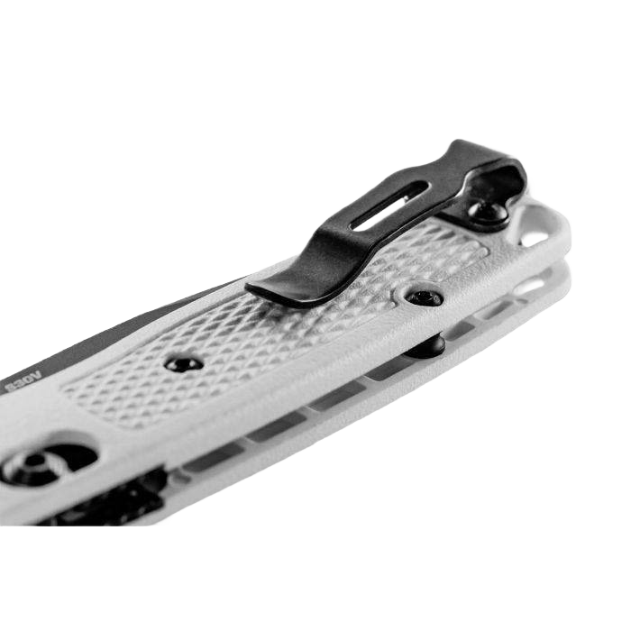 Close-up of white textured pocket knife handle with black clip for secure everyday carry and tool use