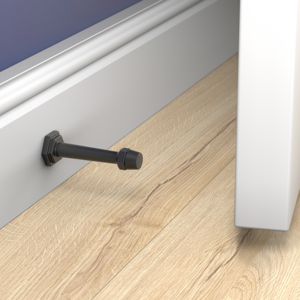 Matte black wall-mounted door stop with hexagonal base protecting wall molding in door accessories and home improvement collections
