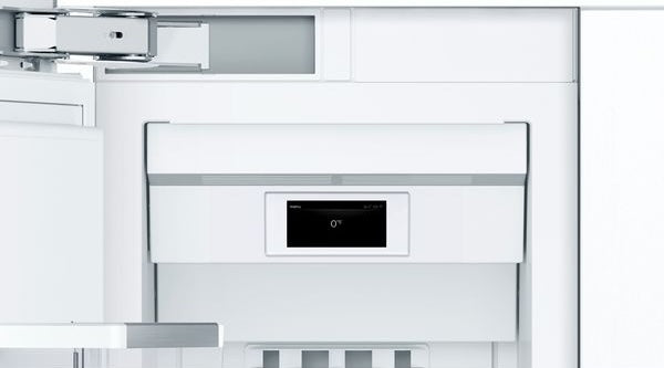 Interior view of a white built-in freezer with flat hinge and digital temperature display from Bosch appliances collection