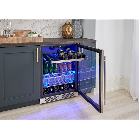 Under-counter reversible single-zone beverage center with glass door, wood racks, and blue interior lighting in kitchen appliances collections