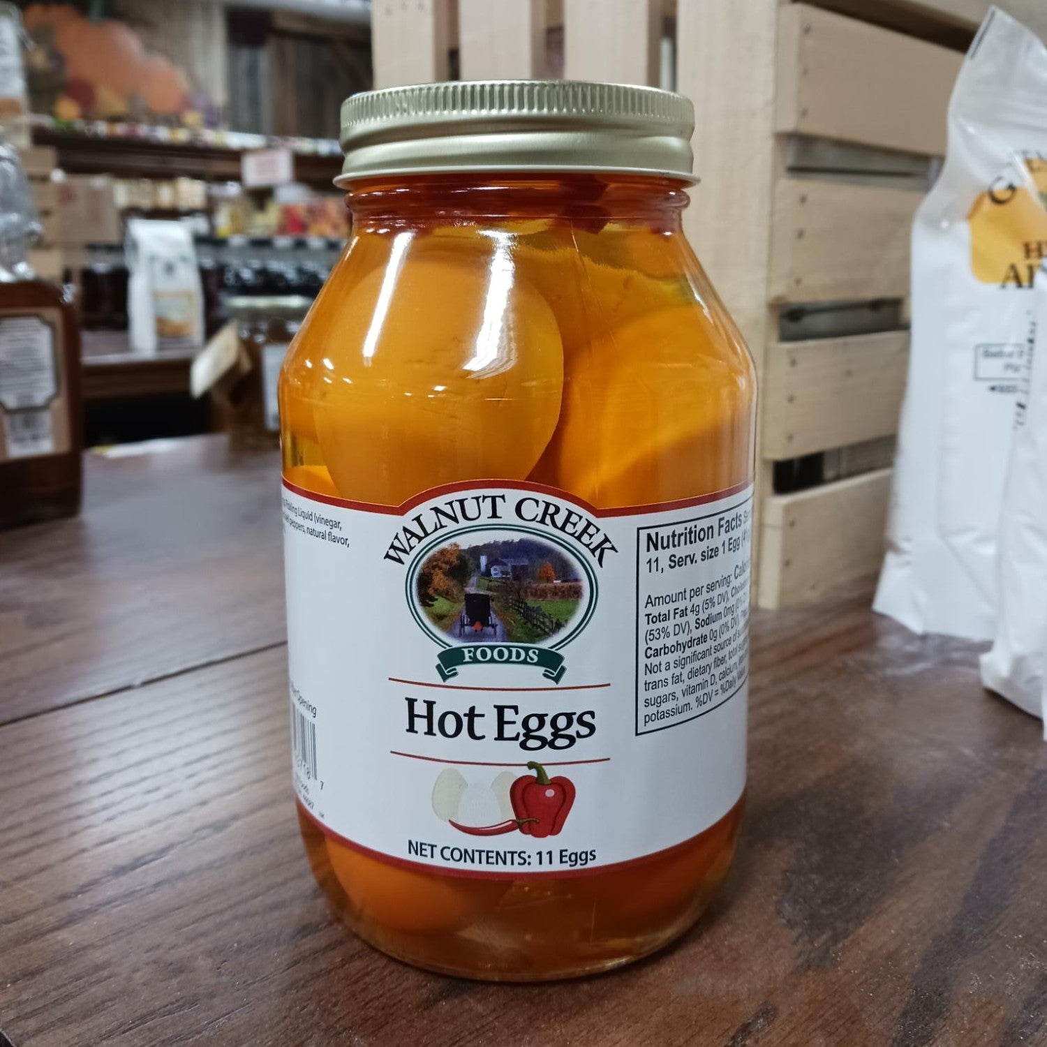 Clear glass jar of spicy pickled eggs in brine with red pepper for Fruits & Vegetables and Under $50 food collection