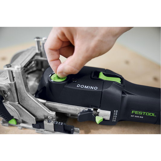 Close-up of a hand adjusting the depth setting on a Festool DOMINO joiner, a precision power tool for woodworking and home improvement projects.