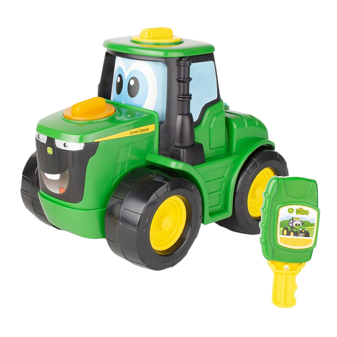 Green and yellow toy tractor with smiling face and matching remote key for interactive play