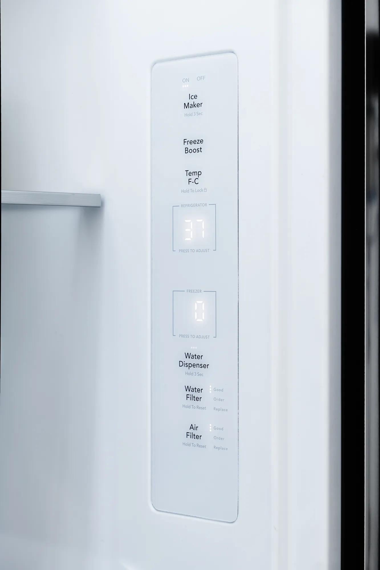 Close-up of digital control panel inside refrigerator door displaying temperature and filter status for home appliance use.