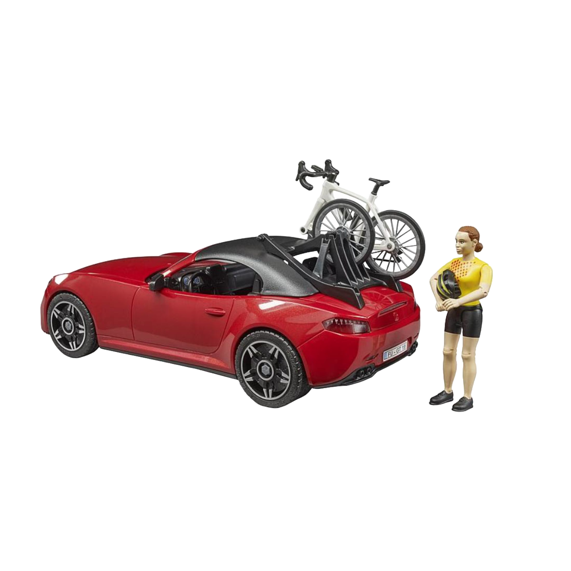 Red toy roadster with black roof carrying white racing bicycle and standing cyclist figure for Bruder Toys collection